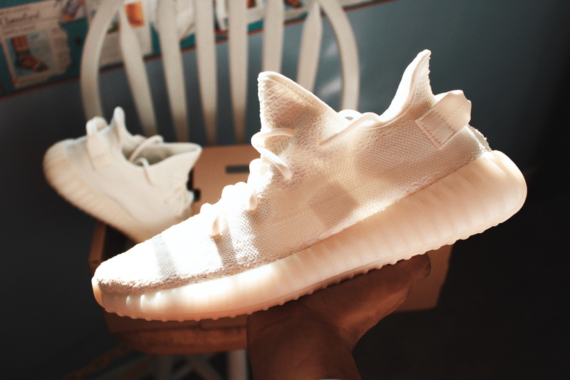 home interior, pair, hypebeast, sneakers, 5K, no people, one animal, cream, white color, shoes, yeezy, focus on foreground, kanyewest, 350, still life
