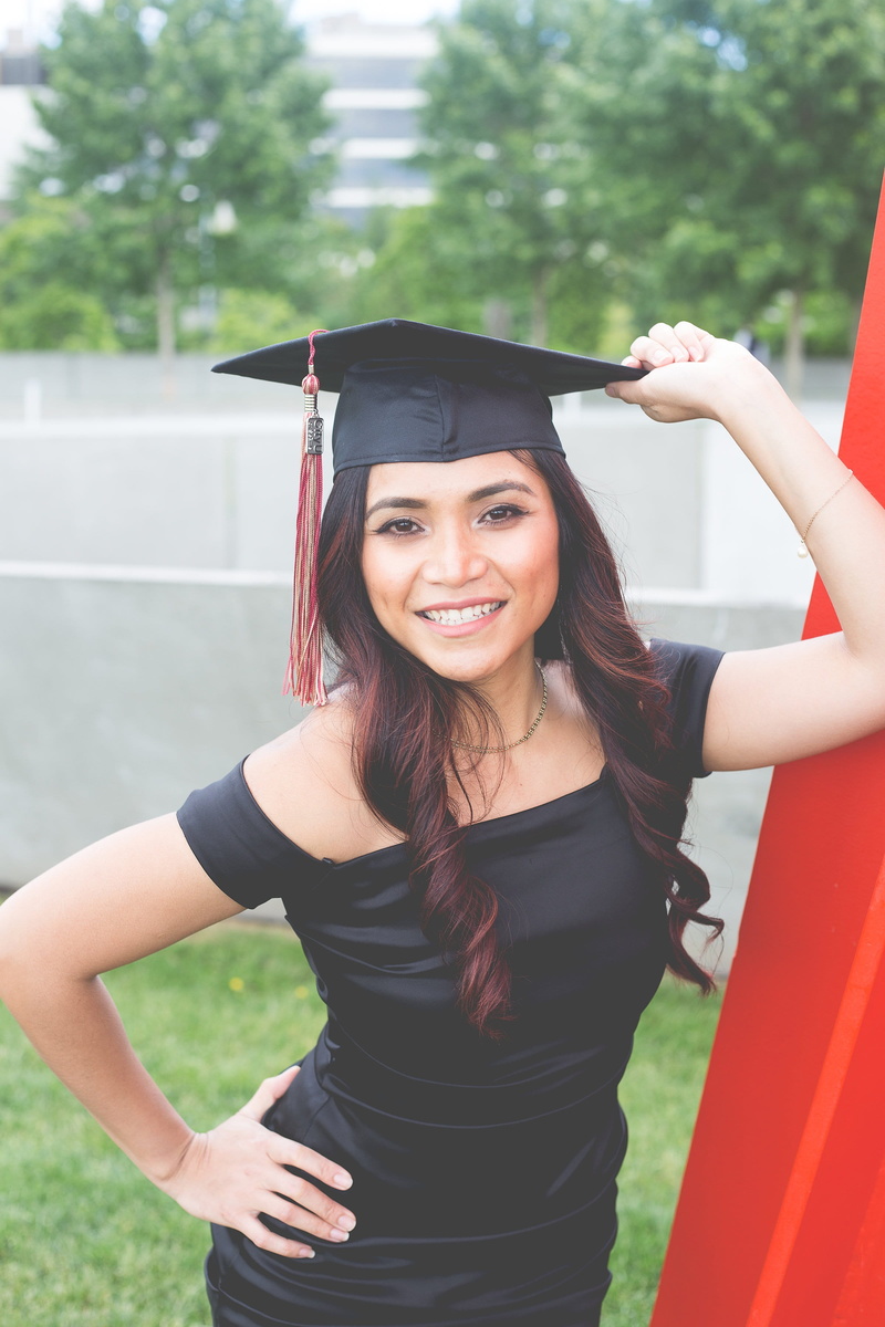 young adult, graduation, graduation gown, degree, graduate, university, looking at camera, hairstyle, education, lifestyles, success, emotion, smiling