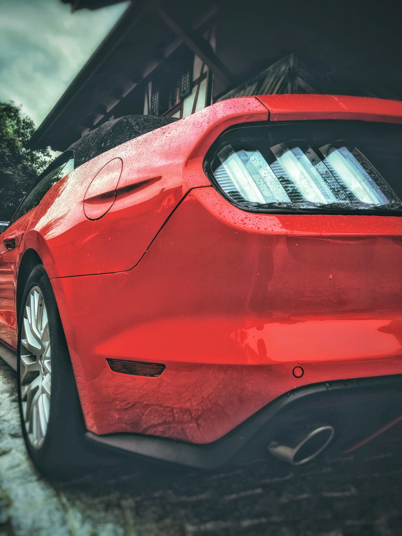 sports car, city, 4K, motor vehicle, reflection, wealth, street, outdoors, red, coupe, car mirror, mustang, focus on foreground, automobile, light, wheel