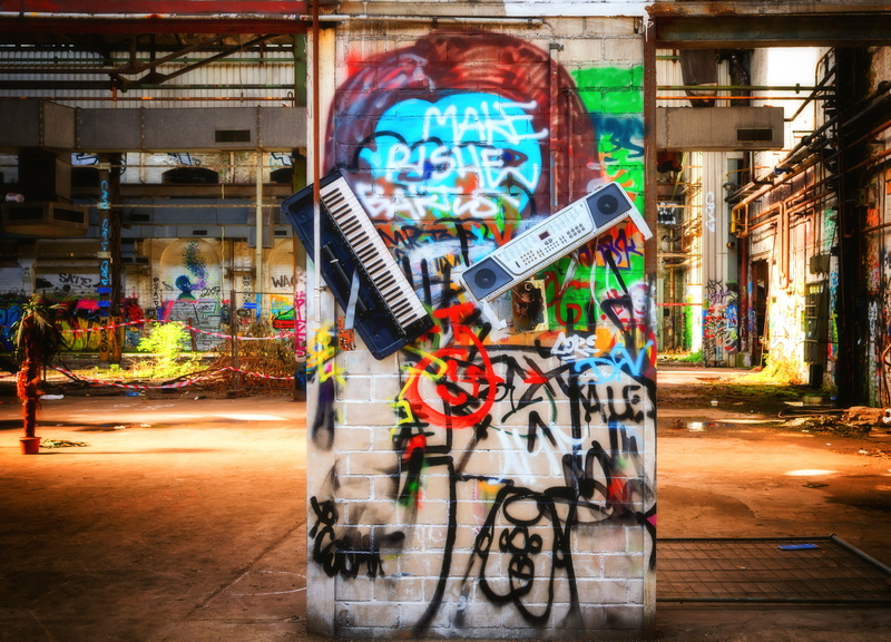 factory, western script, text, mode of transportation, built structure, destroyed, outdoors, transportation, used, keyboard, synthesizer, grafitti, destruction