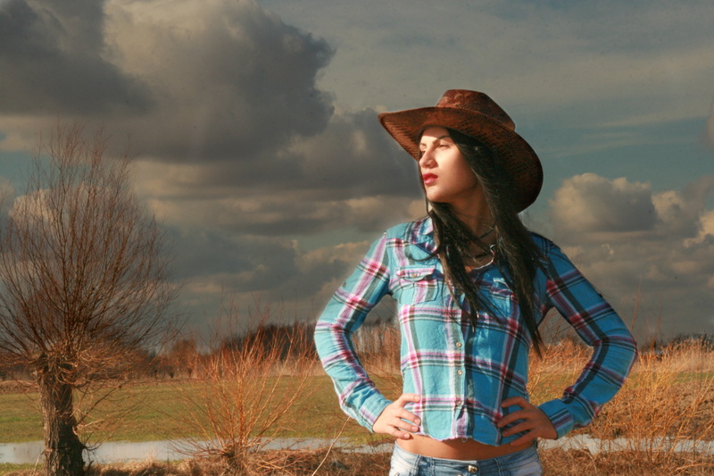 landscape, young adult, red, blue, plant, sand, shirt, sky, woman, sport, western, land, nature, brown, prairie, hat, hairstyle, outdoors, hair, beauty