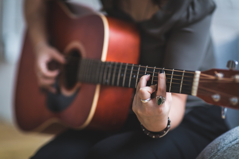woman, holding, inside, strings, leisure activity, ring, acoustic guitar, playing, people, adult, close-up, skill, musician, room, human limb, human hand