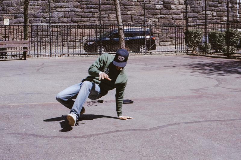leisure activity, apparel, playing field, outdoors, furniture, plant, vehicle, full length, pants, sport, skill, transportation, shadow, slope, hat, balance