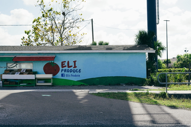 produce, building exterior, vintage vibes, road, symbol, city, architecture, cloud - sky, highway, nature, street, transportation, tree, tarmac, furniture