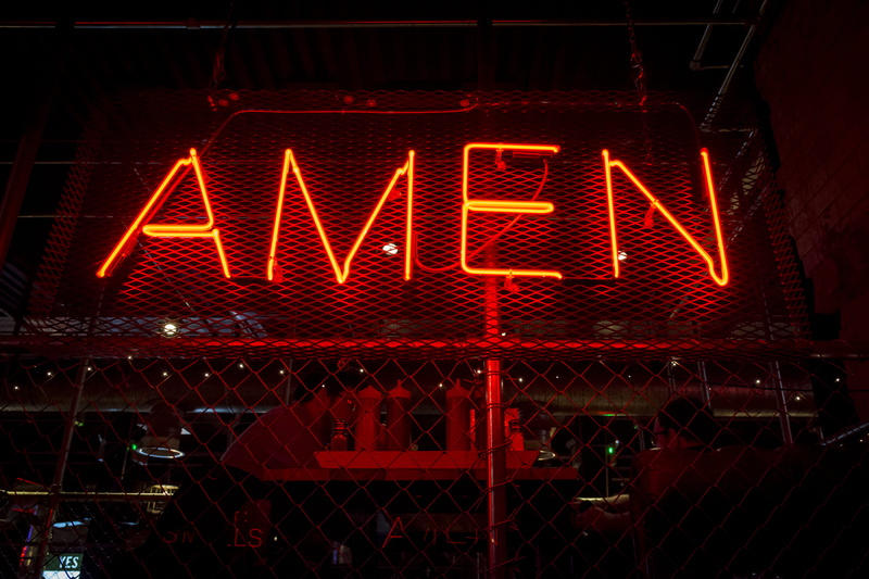 illuminated, lights, amen, orange, 2K, capital letter, sign, barrier, chainlink fence, boundary, arrow symbol, night, architecture, city, western script