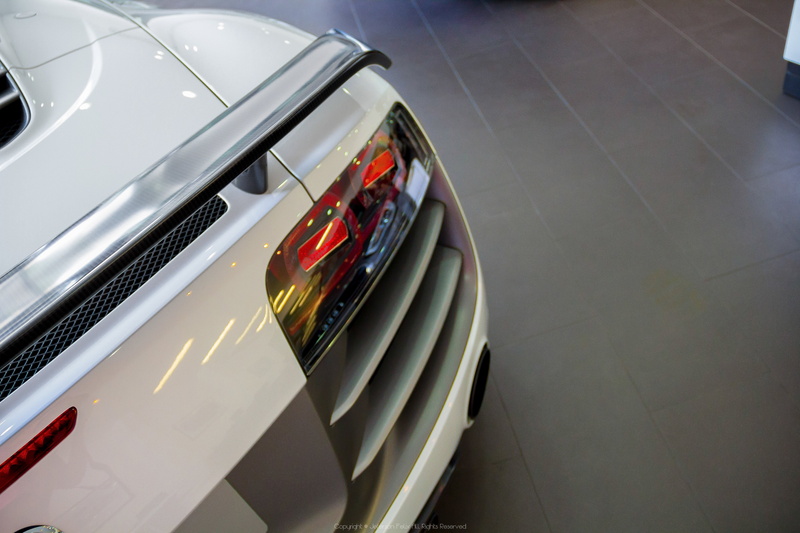 car, chrome, close-up, Audi R8 Spyder, motor vehicle, red, 5K, outdoors, headlight, land vehicle, transportation, reflection, wealth, Audi, sports car