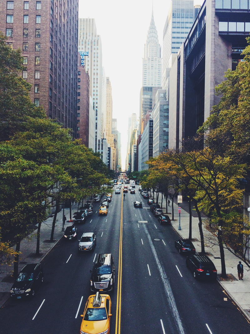 car, mode of transportation, motor vehicle, no people, plant, diminishing perspective, marking, outdoors, land vehicle, architecture, yellow cab, midtown