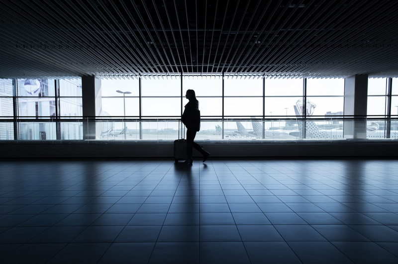 glass - material, lifestyles, flooring, woman, window, waiting, one person, people, travel, men, real people, transparent, walking, 5K, silhouette, tiled floor