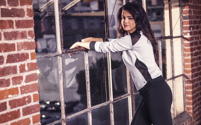 three quarter length, looking at camera, one person, beautiful woman, females, Selena Gomez, young women, architecture, leggings, young adult, hair, standing