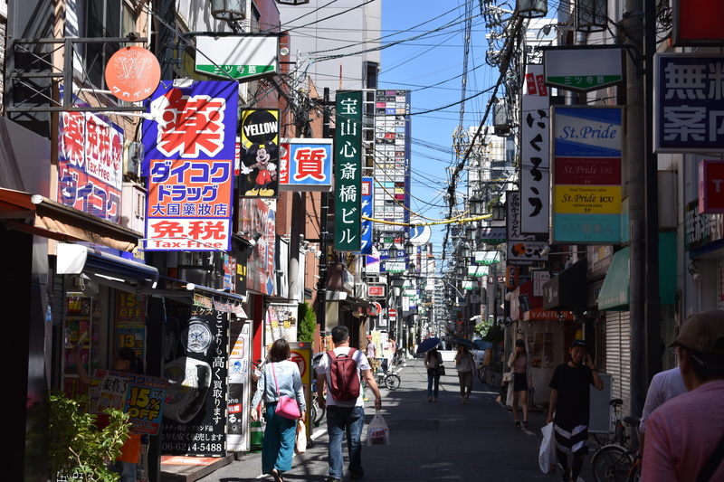 street, transportation, city, communication, potted plant, built structure, text, group of people, pottery, non-western script, japan, osaka prefecture