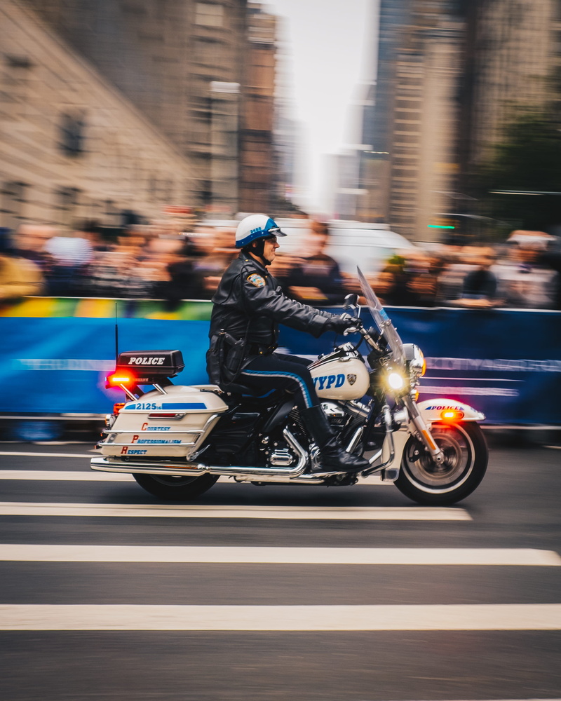 crash helmet, photo, lifestyles, road, outdoors, motorbike, black, land vehicle, city, jacket, beige, policeman, speed, nypd, street, real people, motorcycle