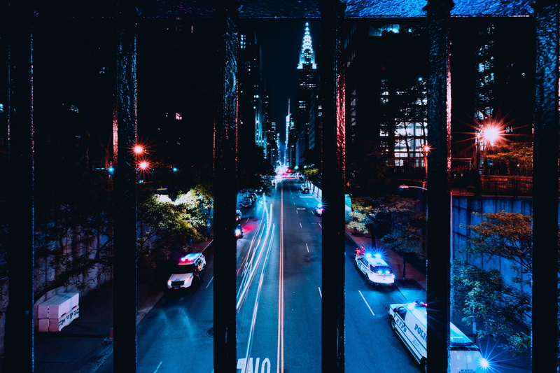 photo, city, outdoors, light, night, land vehicle, new york city, built structure, rail, vehicles, blue, nature, building exterior, motor vehicle, dark