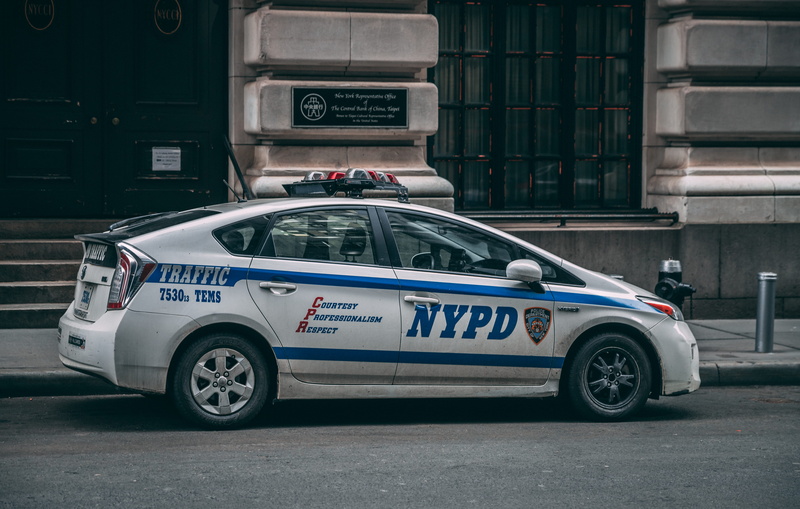 prius, law, text, authority, transportation, police car, building, daytime, car, building exterior, street, near, parked, security, motor vehicle, government