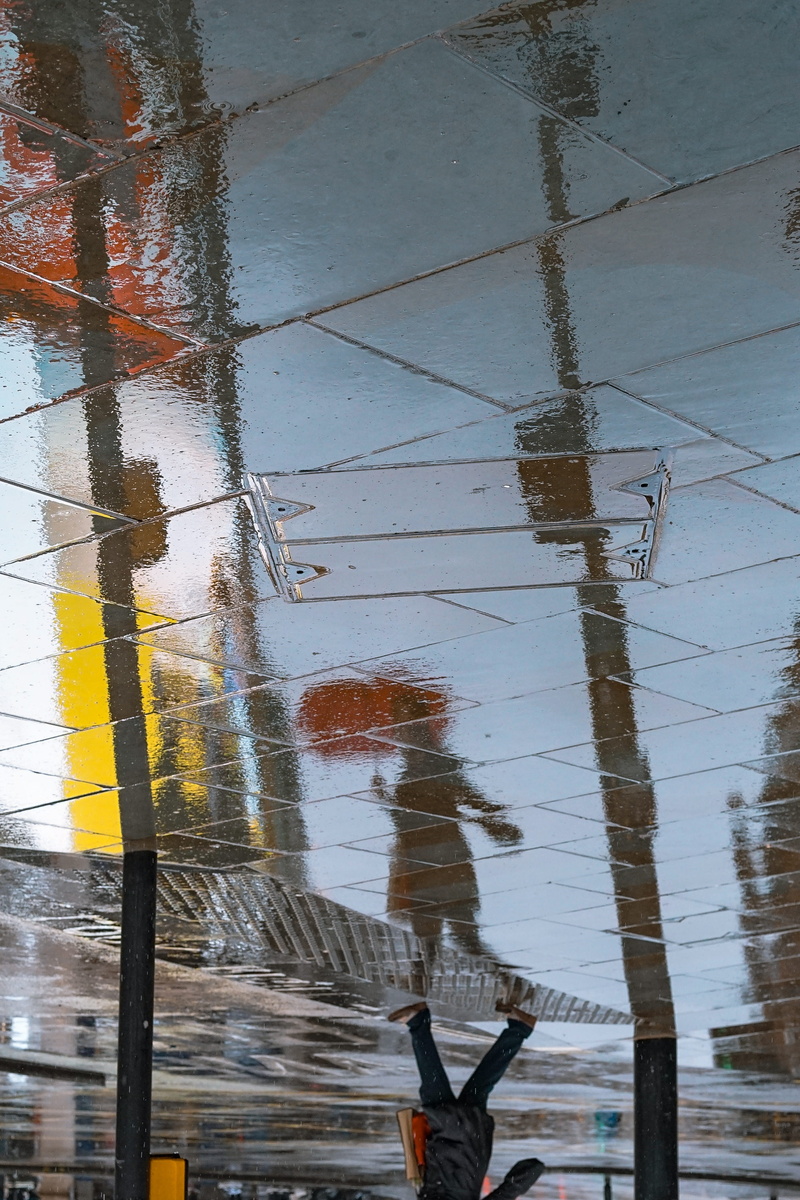 low section, one person, piccadilly circus, rain, london, texture, puddle, walking, high angle view, 4K, umbella, water, shine, outdoors, architecture