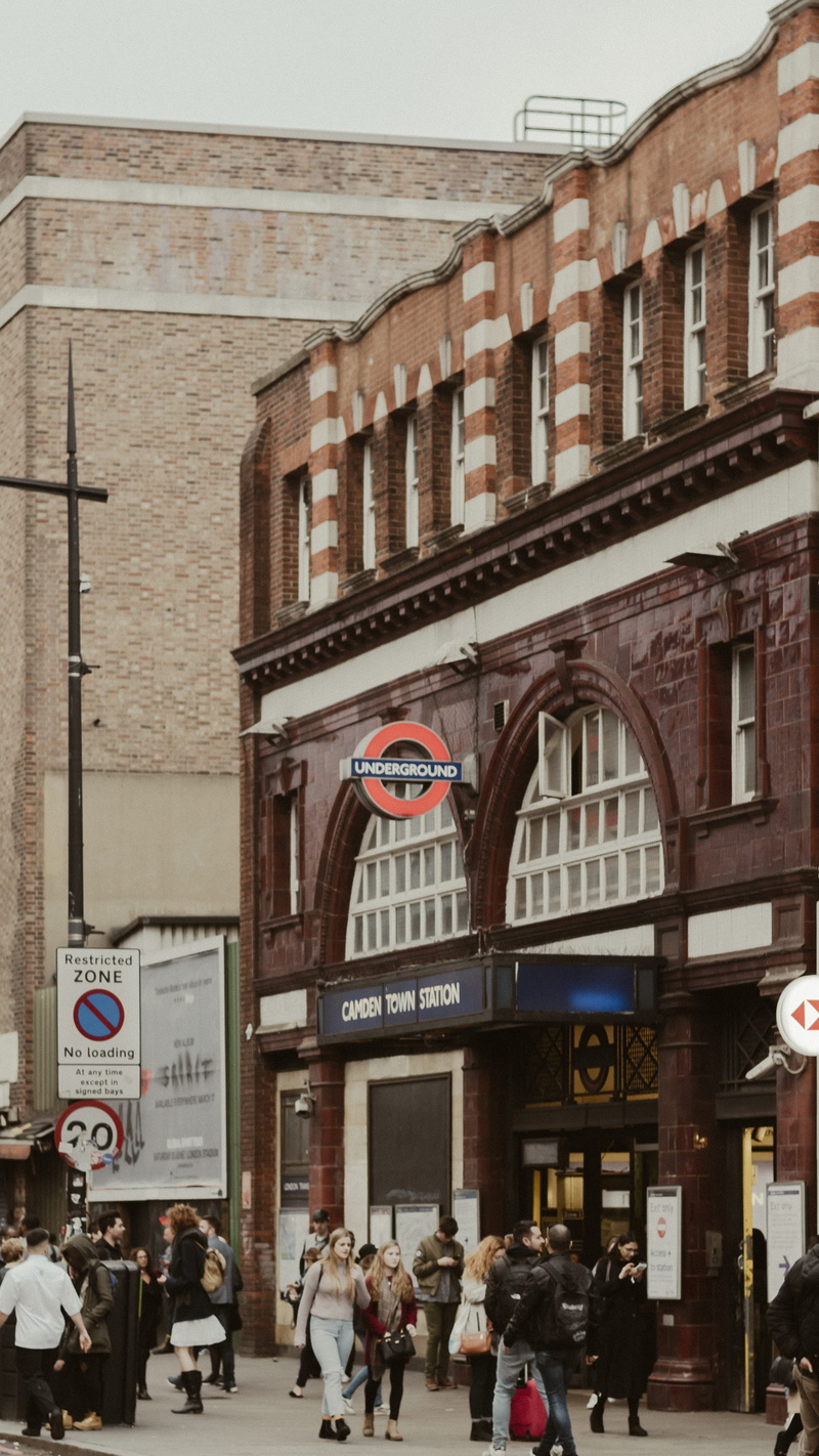 men, crowd, communication, building, city life, tube, built structure, camden town, city, large group of people, town, street, outdoors, united kingdom