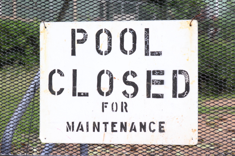 white, maintenance, script, swimming pool, 5K, word, sign, no people, number, chainlink fence, signage, day, western script, non-western script, fence
