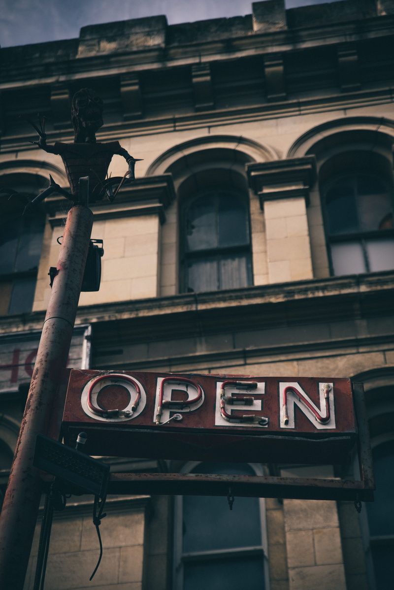 focus on foreground, beside, information sign, explore, information, business, outdoors, letter, building, day, no people, simple, old, open, eye, dark
