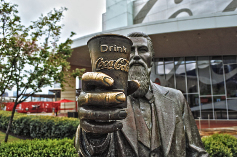 statue, cocacola, sculpture, building exterior, museum, holding, creativity, man, focus on foreground, architecture, cola, plant, 1080P, no people, craft