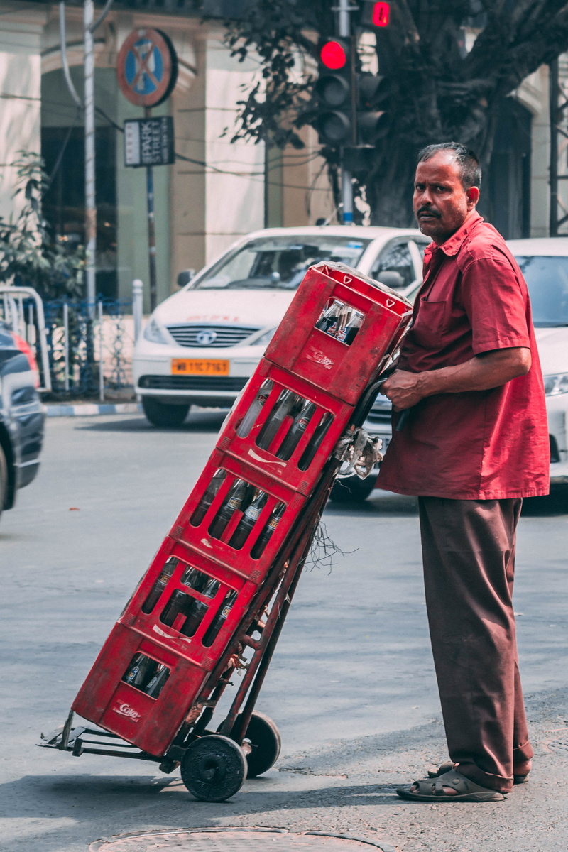 mature men, street, city, outdoors, motor vehicle, indian man, road, red, india, day, architecture, adult, full length, cocacola, real people, land vehicle