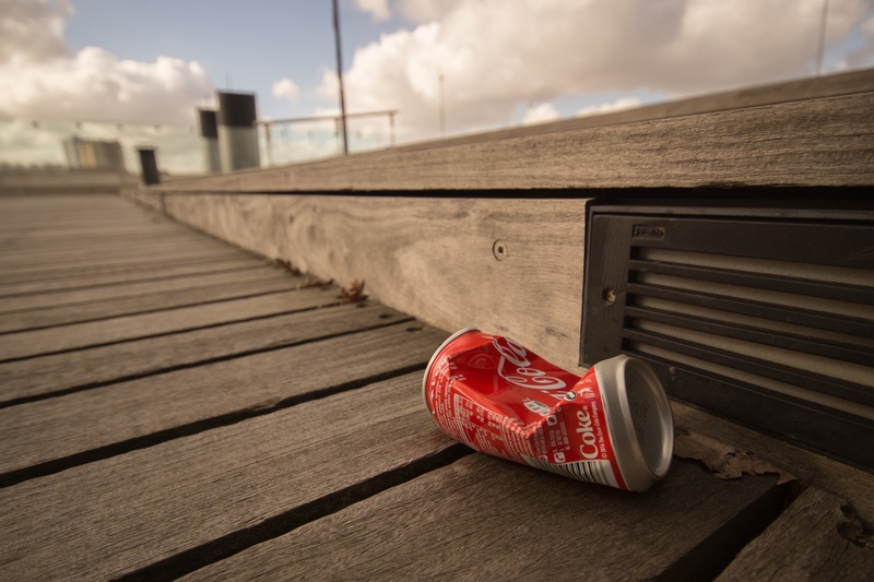 can, brown, garbage, recycle, footpath, trash, cola, wood - Material, surface, wooden, cloud - sky, environment, floorboard, outdoors, littering, red, no people