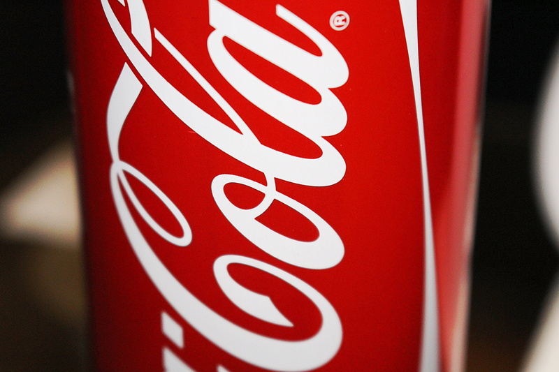 white color, day, capital letter, no people, erfrischungsgetränk, road sign, can, sign, cola, single word, text, logo, cola dose, coke, drink, focus on foreground