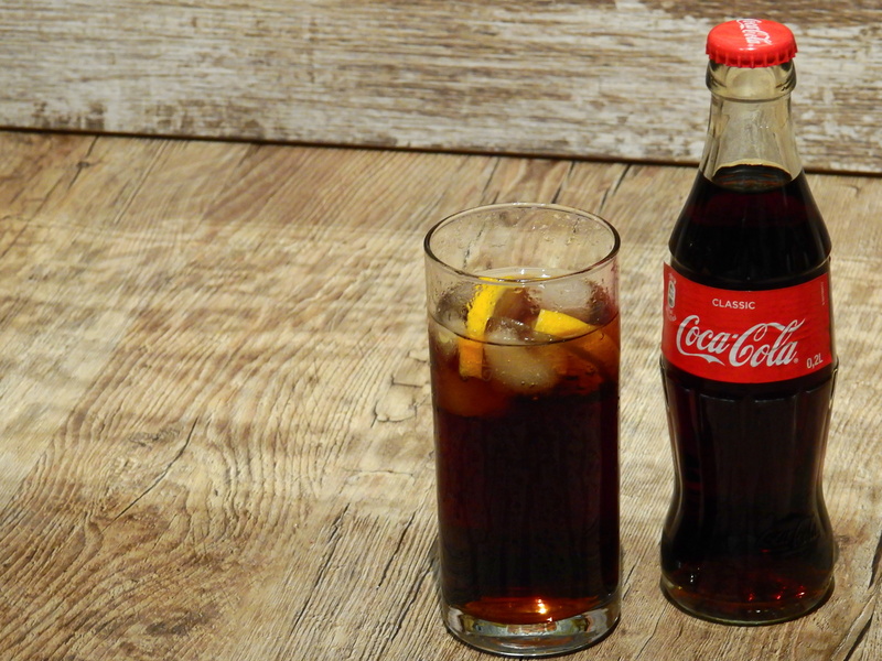 ice, household equipment, coke, beer, ice cubes, brand, thirst, glass, indoors, sugar, refreshment, lemon, food and drink, high angle view, lemonade, drinking