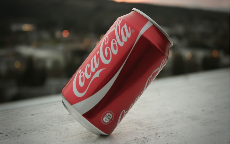 outdoors, communication, healthcare and medicine, no people, table, city, coca, day, text, close-up, western script, brand, security, number, 2K, coca cola