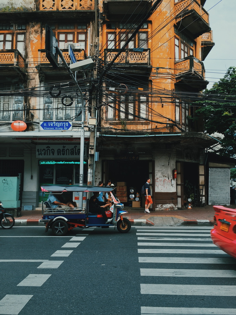city, yaowarat, zebra crossing, outdoors, black, sign, crosswalk, street, car, building, daytime, crossing, architecture, marking, tuk tuk, built structure