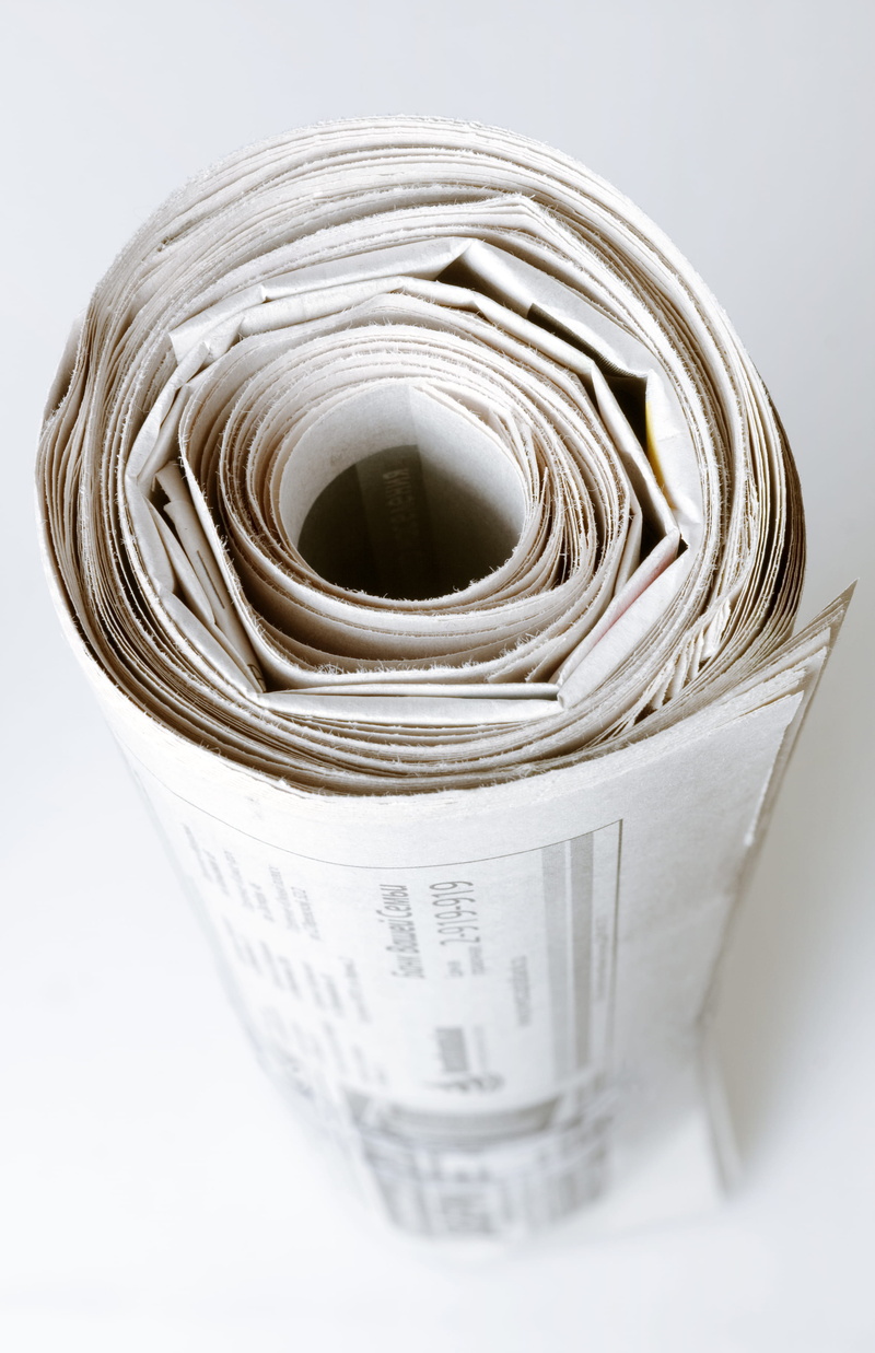 colour, studio shot, container, globalcommunicat, dailynewspaper, broadsheet, themedia, printout, cut out, rolled up, writing, article, focusonforegroun