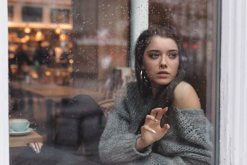 Polish women, looking out window, Dagmara Podolak, portrait, cafeteria, long hair, hoop earrings, women, Kuba Brencz, window, 1080P, rain, grey sweater
