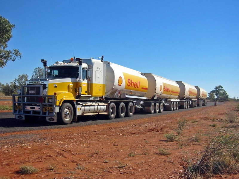 no people, rail transportation, Road Train, industry, track, train, road, semi-truck, clear sky, truck, Mack Trucks, land vehicle, mode of transportation