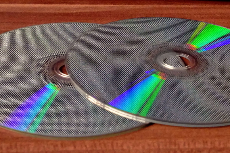 4K, technology, close-up, cd, indoors, metal, geometric shape, video, multi colored, eye, recording, compact disc, circle, plastic, still life, design