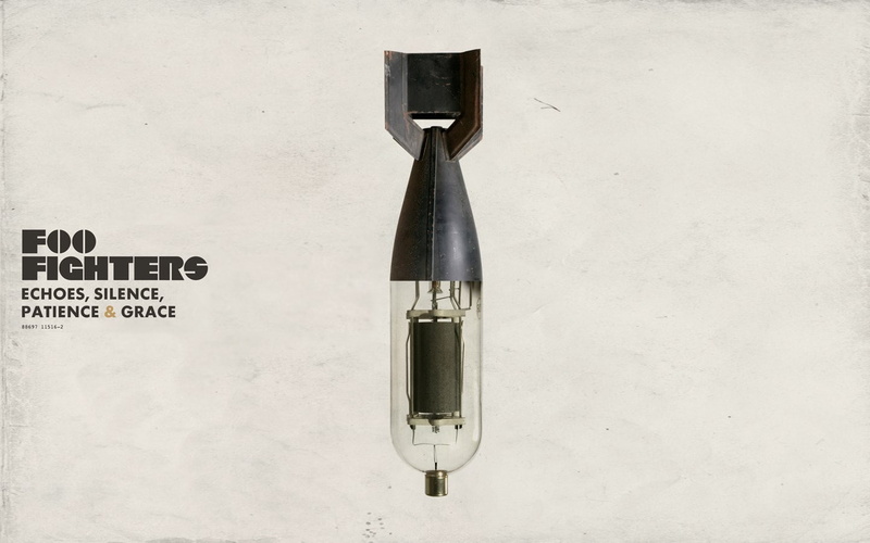 no people, gun, wall - building feature, work tool, text, indoors, close-up, still life, concrete, security, aggression, metal, equipment, foo fighters