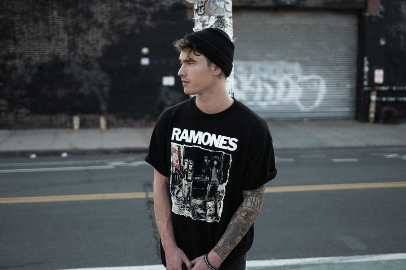 casual clothing, graphic, crew, teenager, day, neck, waist up, architecture, shirt, front view, wearing, ramones, t, black, text, contemplation, knit, portrait