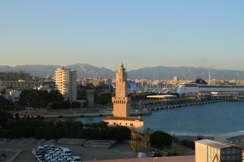 connection, skyscraper, travel destinations, river, outdoors, clear sky, architectural column, light house, city, nature, history, sky, porto pi, mallorca