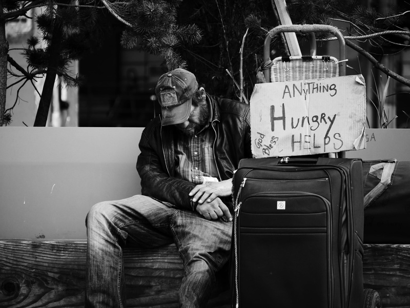 pain, casual clothing, man, day, sad, suitcase, 4K, seat, text, homeless, western script, young adult, front view, poor, real people, sign, sitting, blackandwhite