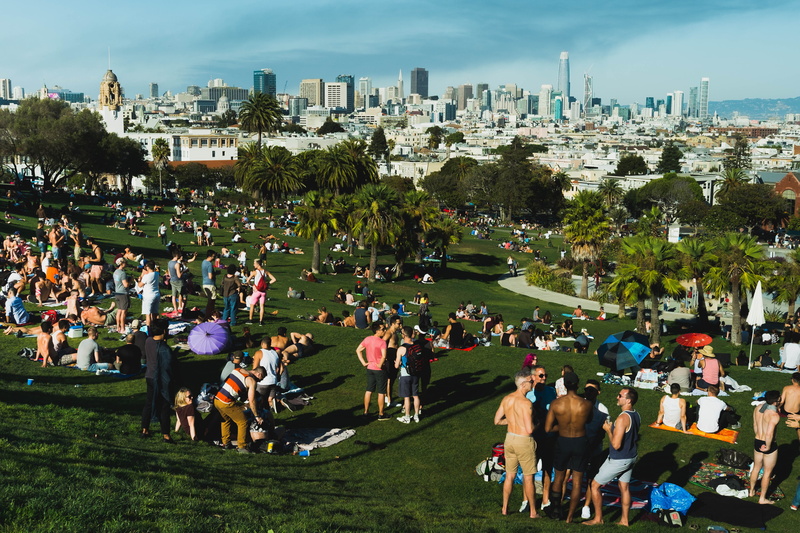 skyscraper, plant, real people, office building exterior, crowd, building, built structure, mission dolores park, architecture, leisure activity, outdoors