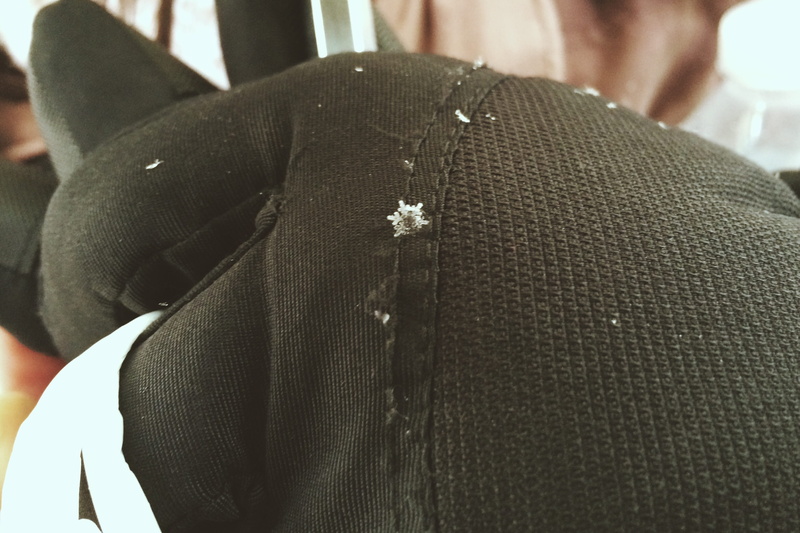snowflake, one person, close-up, united states, real people, textile, casual clothing, men, new york, hand, 2K, suit, theater district, focus on foreground