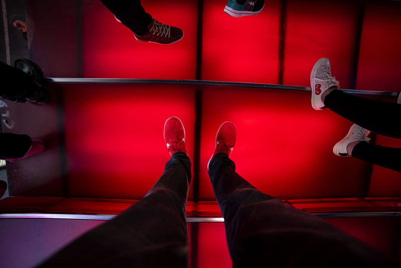 limb, theater district, indoors, people, leather, human leg, men, shoe, body part, low section, unrecognizable person, human limb, human body part, leisure activity