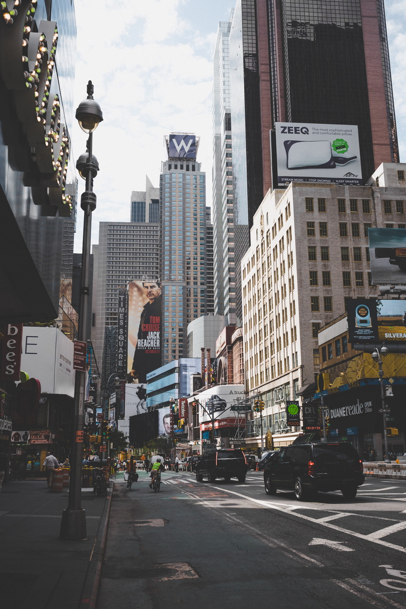 street, outdoors, skyscraper, ad, people, city life, transportation, modern, united states, incidental people, sign, built structure, billboard, advertisement