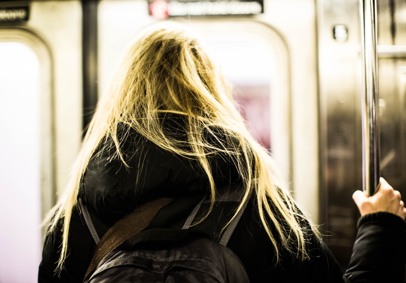 metro, adult, real people, public transportation, focus on foreground, city, long hair, women, warm clothing, commute, united states, hairstyle, headshot