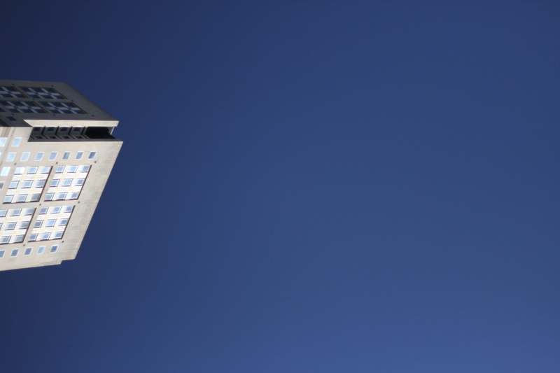 clear sky, copy space, low angle view, built structure, metropolitan, building, text on top, wall - building feature, nature, architecture, day, lighting equipment