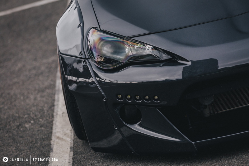 car, low, Carninja, black color, outdoors, tire, sport, motorsport, wheel, transportation, high angle view, helmet, headwear, day, mode of transportation