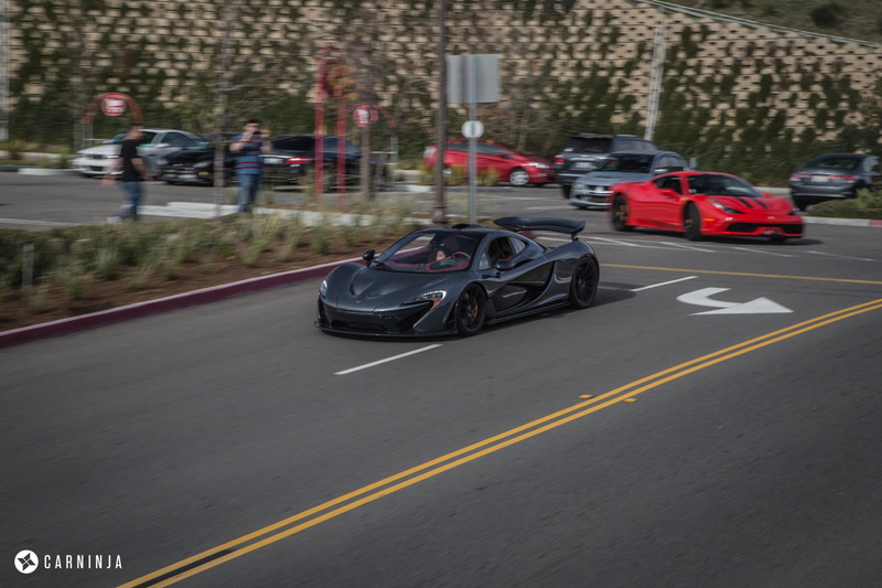 car, Carninja, day, low, sport, sign, incidental people, mode of transportation, speed, real people, transportation, motion, marking, group of people, street