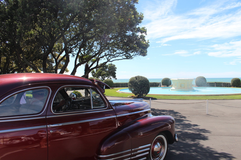 fountain, wheel, new zealand, daytime, sea, napier, architecture, auto, 5K, luxury, vehicle, sky, trees, sun, landscape, cloud - sky, red car, tree, land vehicle