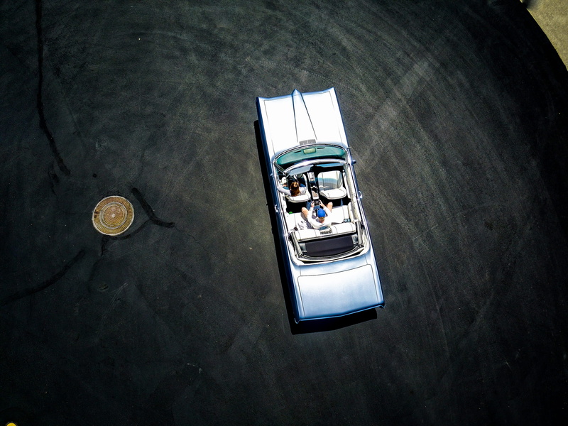 top, scale, colored, two objects, model, diecast, coin, gold, close-up, wealth, outdoors, mode of transportation, Pontiac, car, toy, vehicle, shadow, still life