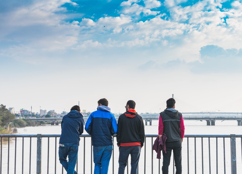 denim, front, banister, railing, iran, ice, women, standing, togetherness, casual clothing, pants, nature, day, jacket, clothing, water, fence, sky, people