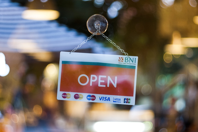store, focus on foreground, selective focus, hanging, informative, outdoors, day, western script, selective, entrance, sign, door, close-up, text, closed