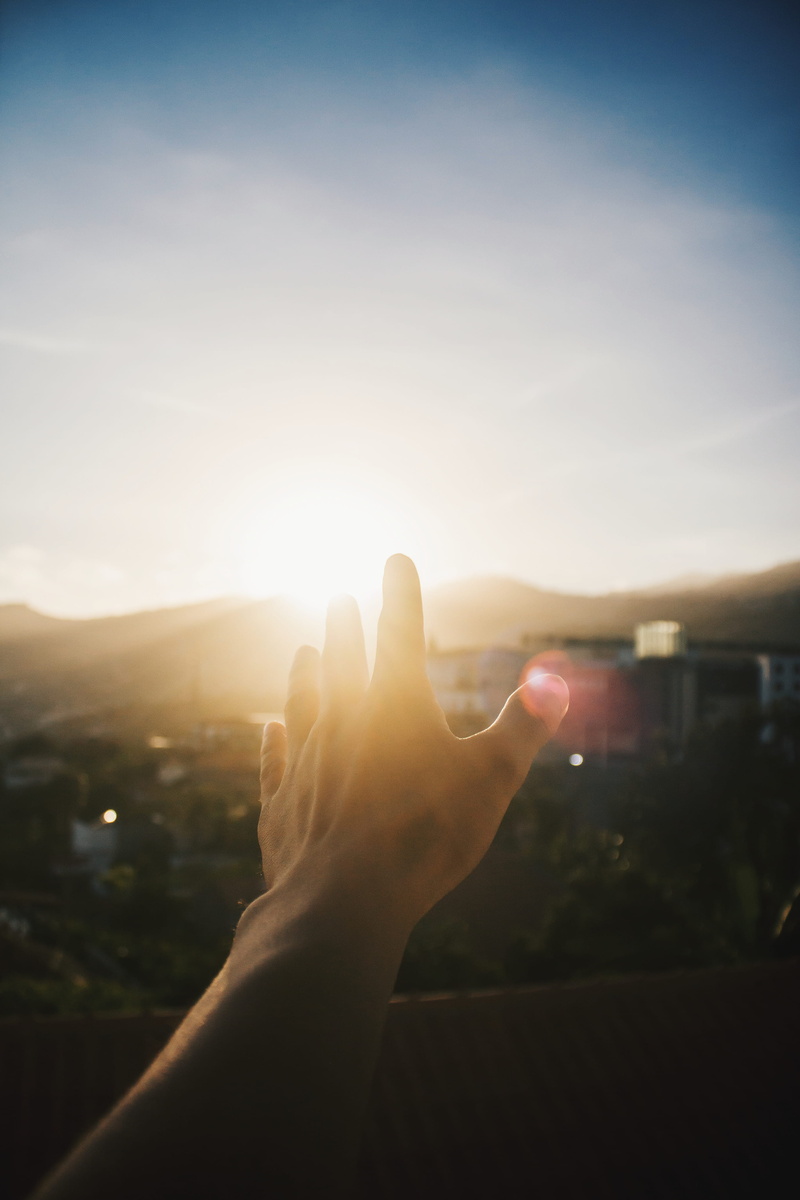 lifestyles, sunset, human hand, bright, orange, personal perspective, skies, reaching, sun, human foot, finger, real people, human limb, sky, lens flare