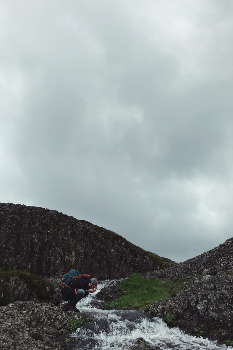 cloudy, no people, mountain, scenics - nature, brook, man, non-urban scene, sky, land, mode of transportation, rock, nature, water, rock - object, tranquility